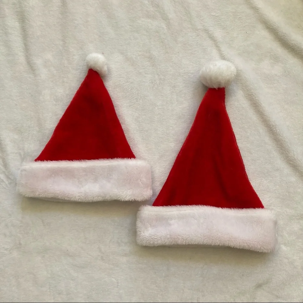 Set of two Santa hats with white pompoms